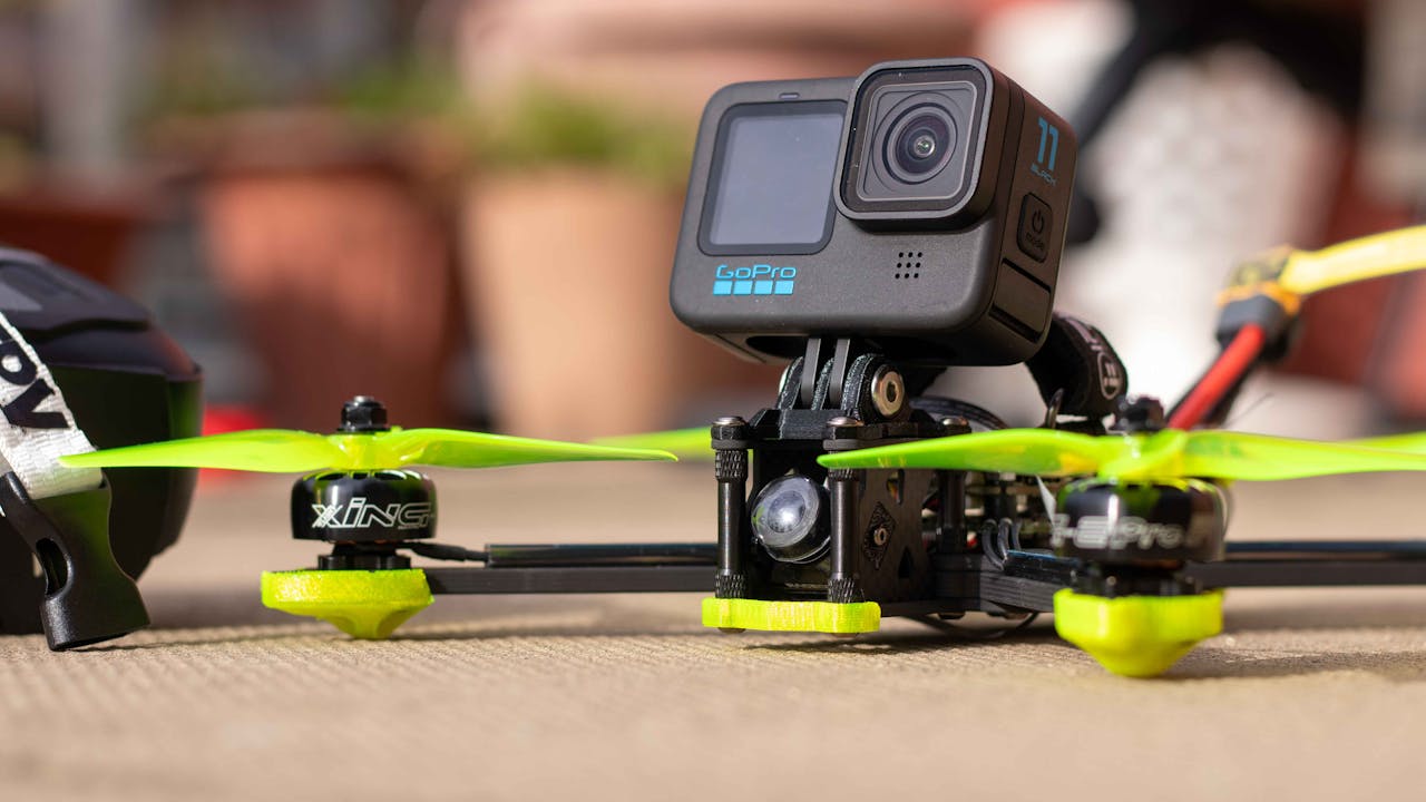 Close-up of a drone equipped with an action camera, ready for aerial adventures.