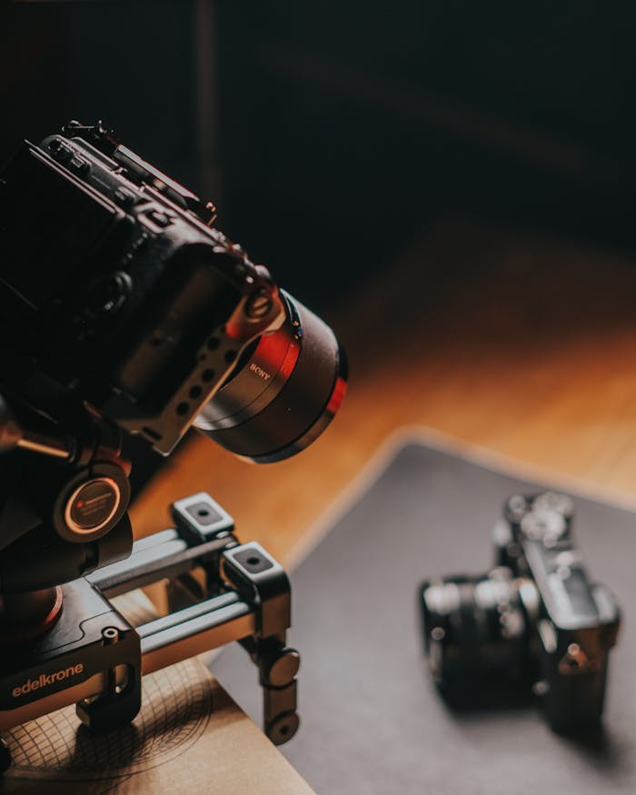 Close-up of a DSLR camera mounted on a stabilizer for videography setup.